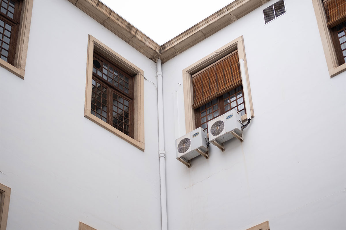 How much to install air conditioning: Cool-Time technician installing a commercial system in Adelaide